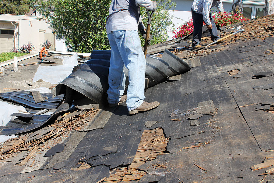 Workers Removing and Replacing Roofing