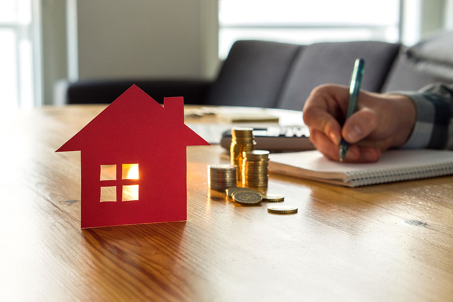 Man Calculating Home Value