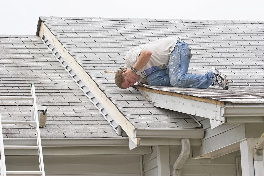 Roofer checking for roof damage