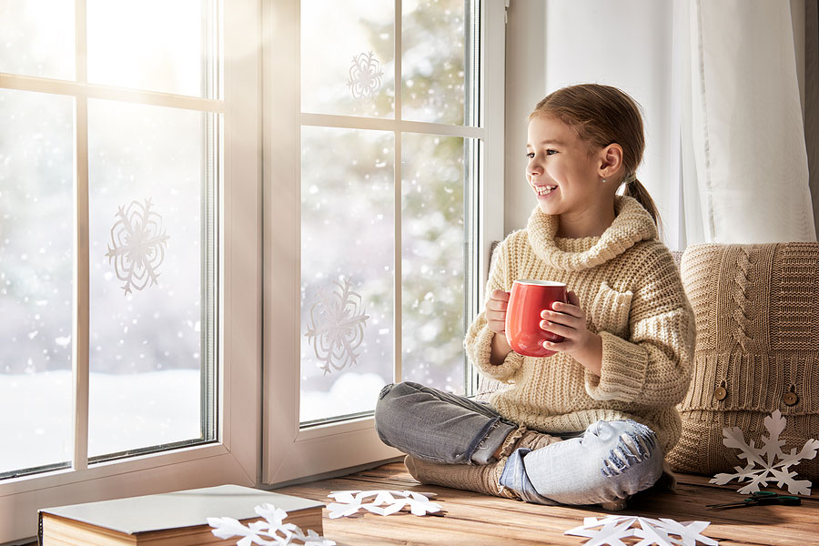 Little Girl Sitting By Windows