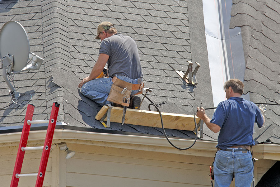 Roofers Working on Asphalt Shingle Roof