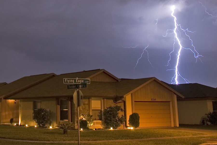 Lightning Strike During Storm Near Homes